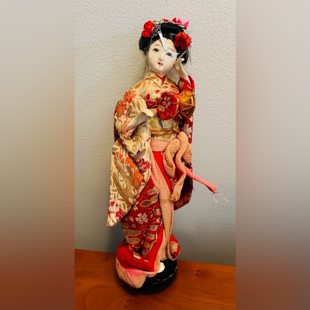 Vintage miniature, hand painted Japanese doll. 10" tall.